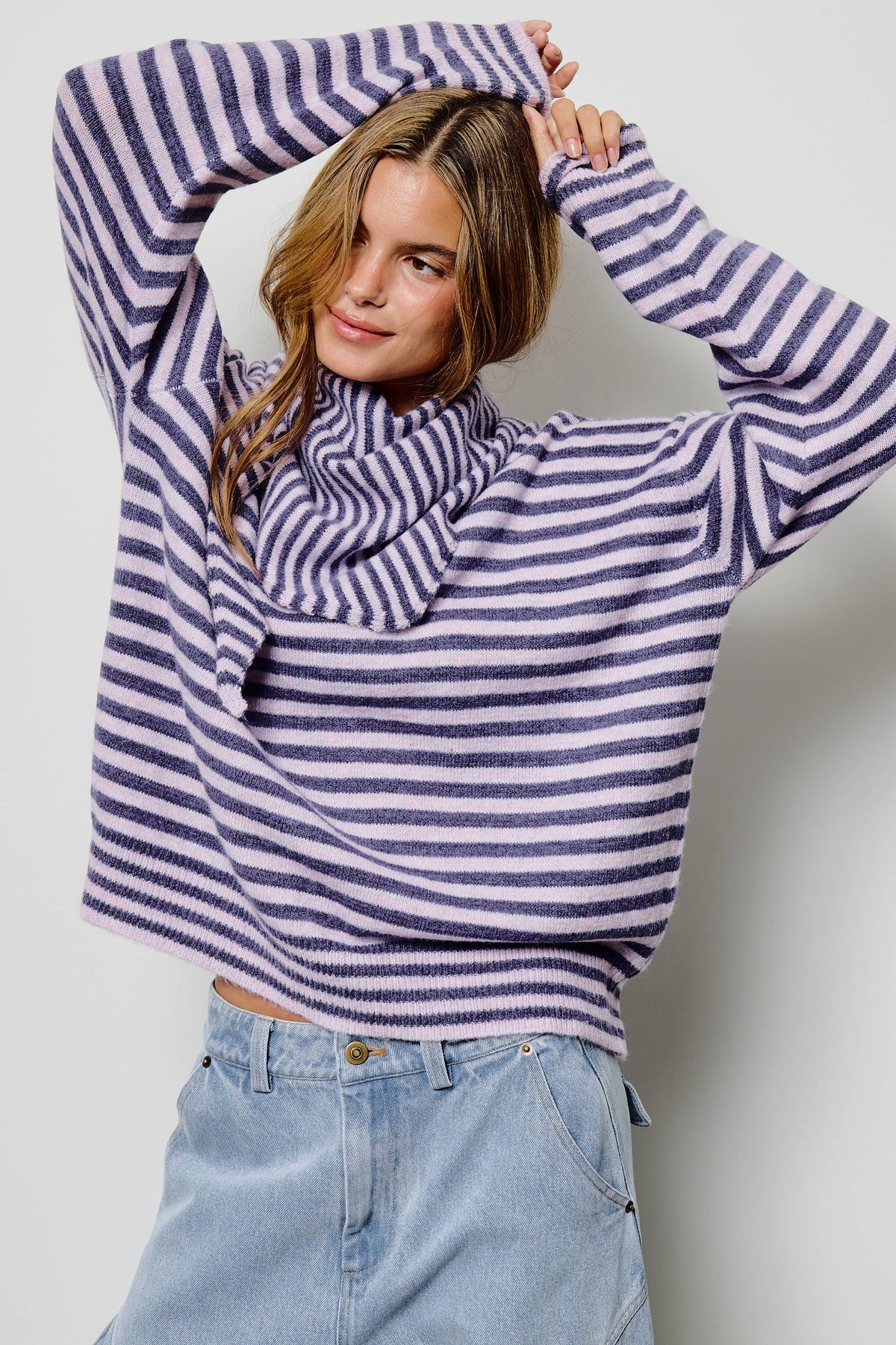 Women’s long sleeve purple striped sweater, made from brushed knit fabric. Crewneck & drop shoulder. It comes with a matching striped scarf to style.  